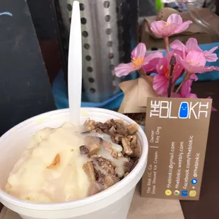 a bowl of ice cream with nuts