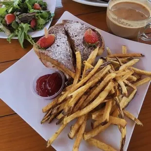 Steak and Eggs with toast and Santo Cristo sandwich with fries