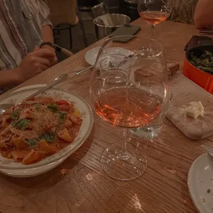 Rosé, pappardelle pasta, country loaf, and shishito peppers