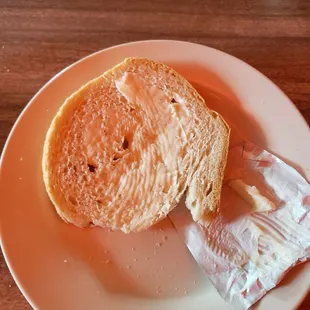 a half eaten sandwich on a plate
