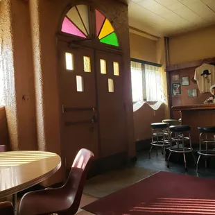 a dining room with a table and chairs