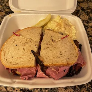 a sandwich in a styrofoam container