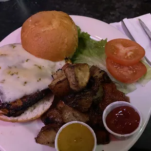 Chicken Sandwich with gluten free bun, roasted potatoes, honey mustard sauce, and house made chutney.