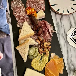 a platter of meats and cheeses