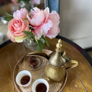 a teapot and two cups of coffee