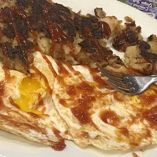 an omelet, hash browns, and eggs