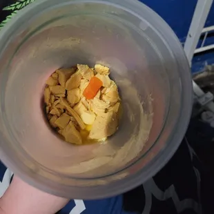 At the bottom of the quart, no noodles just a few pieces of chicken