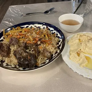 a plate of food and a bowl of mashed potatoes