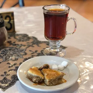 a plate of food and a cup of tea