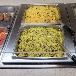 a variety of food in a buffet