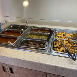 a buffet with a variety of food items