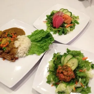 three plates of food on a table