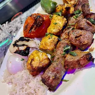 a plate of grilled meat and rice