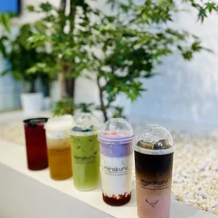 Mirakuru moonlight, white peach oolong, green Thai pandan coco milk, Korean strawberry milk with ube foam, strawberry milk coffee