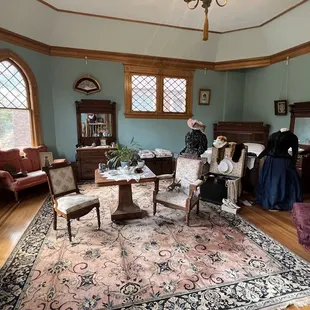 the living room of a victorian mansion