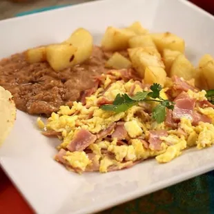 Eggs with game, beans and Fried potatoe cubes.