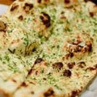 Garlic Chaib Nan Leavened oven baked flat bread stuffed served with butter on the top