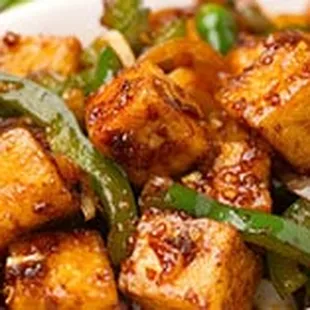 Chill Paneer Pressed Indian Cheese in a Hot Soy Chili Sauce. Served Dry or Gravy