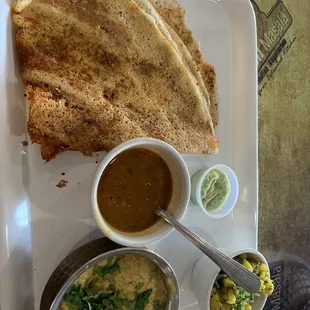 Dosa with masala potatoes, sambar, and coconut chutney, and malai kofta