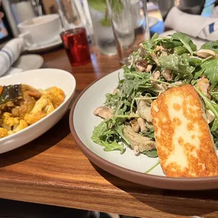 Spiced Fall Vegetables - roasted vegetables &amp; plated over green tahini sauce and Grilled Halloumi Cheese &amp; Artichoke Heart Salad