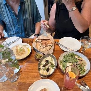 Fluffy Pita, Miriam&apos;s Hummus, Grilled Halloumi Cheese &amp; Artichoke Heart Salad, white asparagus special.