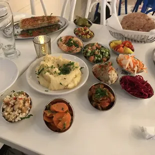 Salads, dips and corn skewer