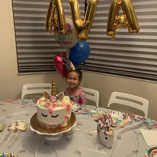 a little girl at a birthday party