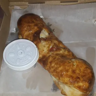 a half eaten pizza in a box