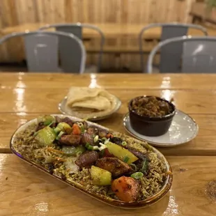 a plate of food on a wooden table