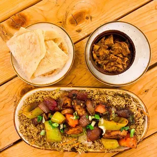 a plate of food and a bowl of chips