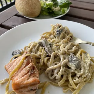 Roll, Caesar Salad, Fettuccine pasta with funghi mushrooms, cream, and Parmesan sauce + salmon