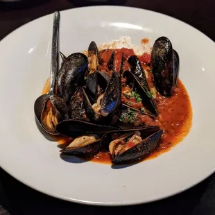 a plate of steamed mussels