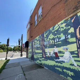 a mural on a brick building