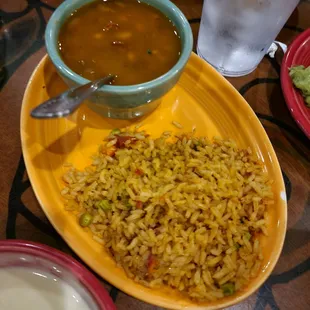 a bowl of soup and a plate of rice