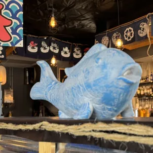 a blue fish on a bar