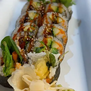 a sushi roll on a white plate