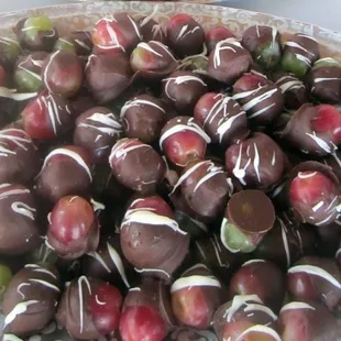 a plate of chocolate covered cherries