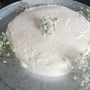 a white cake with baby's breath