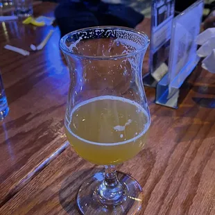 a glass of beer on a table