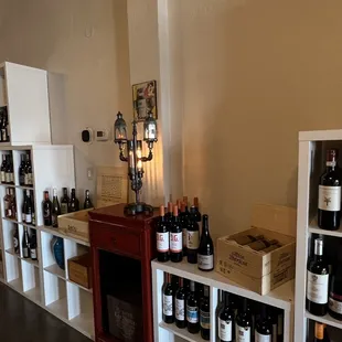 a wine shop with wine bottles on shelves