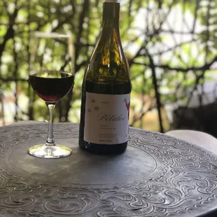a glass of wine on a table