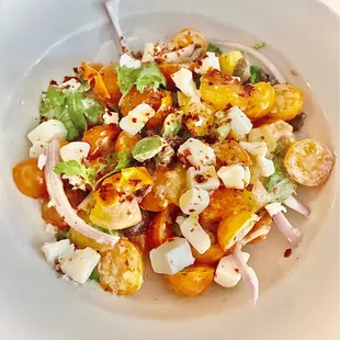 Sungold tomato salad with ricotta salata, cilantro, red onion