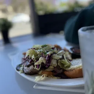 Brisket sandwich with bechamel Mac and cheese with slaw.