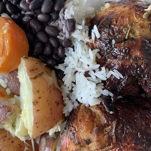 Half Charbroiled Chicken, beans on rice and cheesy potatoes.