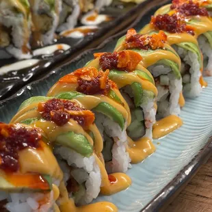 a row of sushi rolls