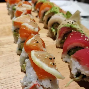 sushi rolls on a wooden board