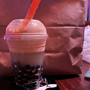 A whole cup of syrup half filled with tapioca