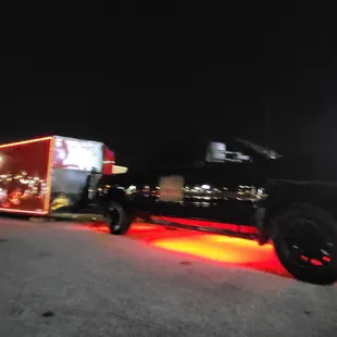 a truck with a trailer in the back