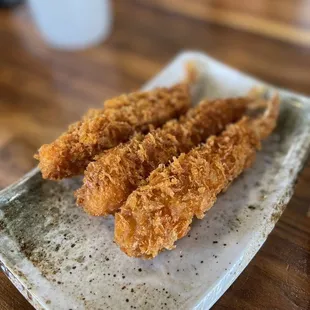 fried shrimp sticks on a plate