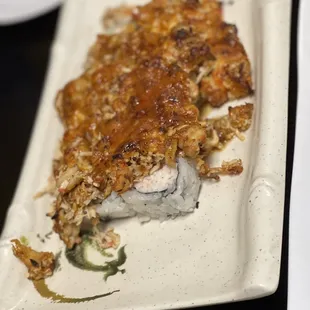 a piece of sushi on a plate